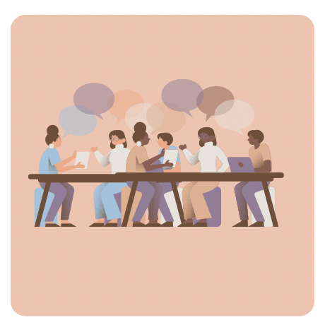 A team of people sitting at a desk working together with laptops and speach bubbles 