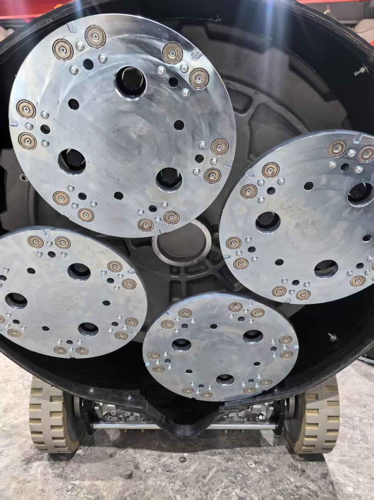 Tool plate on an R650 concrete grinder designed for trapezoid diamond grinding tools.