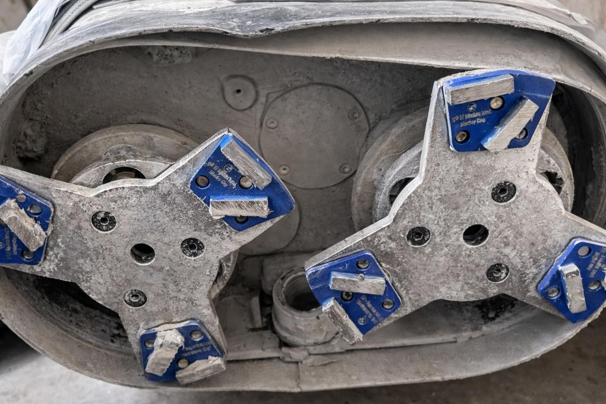 ASL T2 magnetic plates with clockwise PCD for epoxy coating removal and 16 grit MEDIUM bond metal diamonds for cleanup concrete floor grinding.