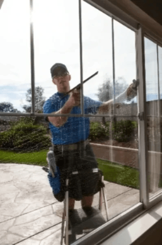 Residential Window Cleaner in Mandurah Cleaning a home's Window