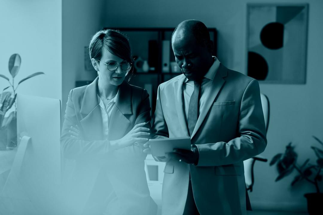 Professional service provider working at a desk with client paperwork, representing service-based businesses