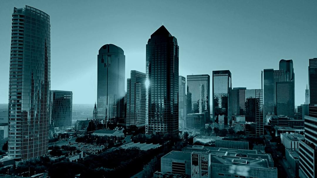 Downtown Dallas skyline at sunset with modern architecture — representing innovation, opportunity, and Texas-sized ambition for growing brands.