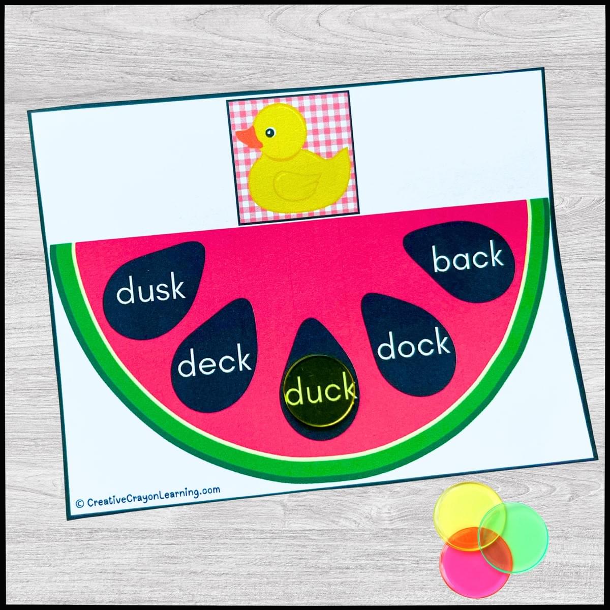 Watermelon-themed summer literacy center for kindergarten and first grade with CVC and blend/digraph word matching using bingo chips.