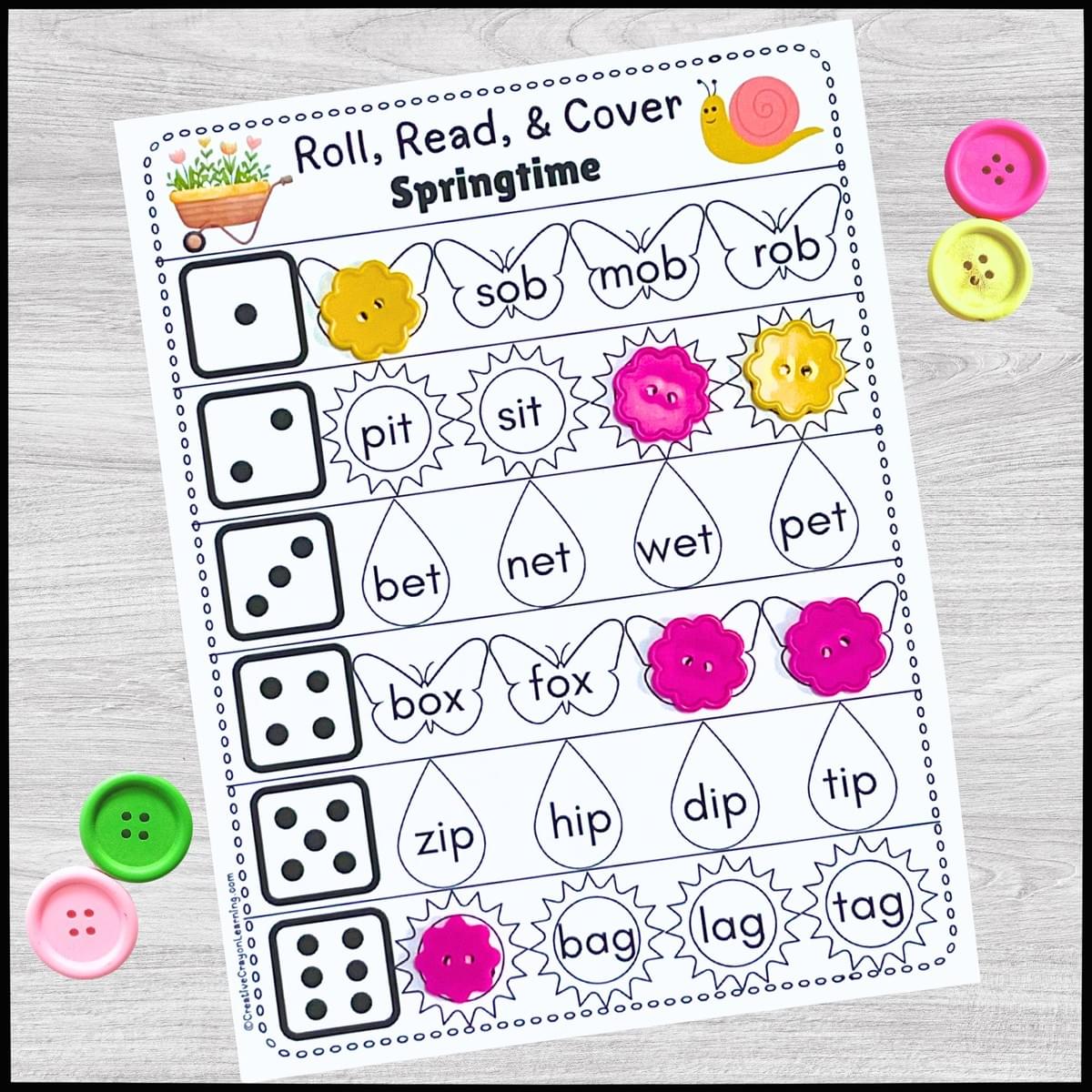 Hands-on spring CVC word reading activity with dice and cover mats for kindergarten