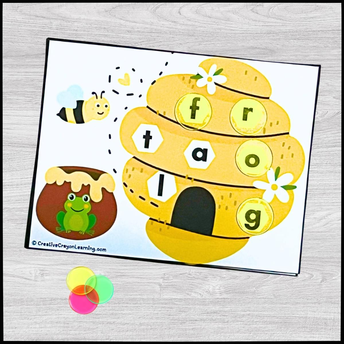 Beehive Spelling Buzz printable CVC activity for kindergarten with honey jar picture and letter matching.