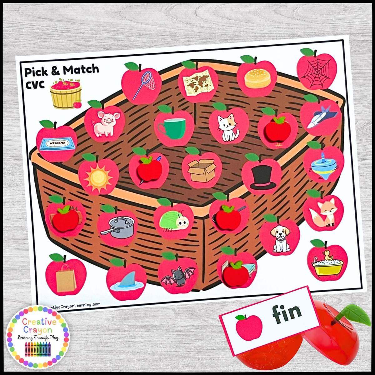 Apple-themed literacy center for kindergarten with plastic apples, word cards, and matching mats.