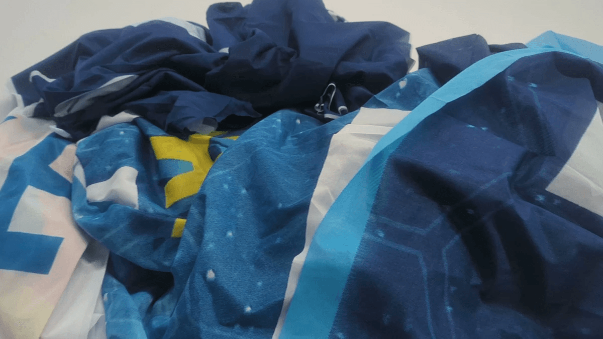 An informal seamstress in Bangkok sews a strap for a Morph bag.