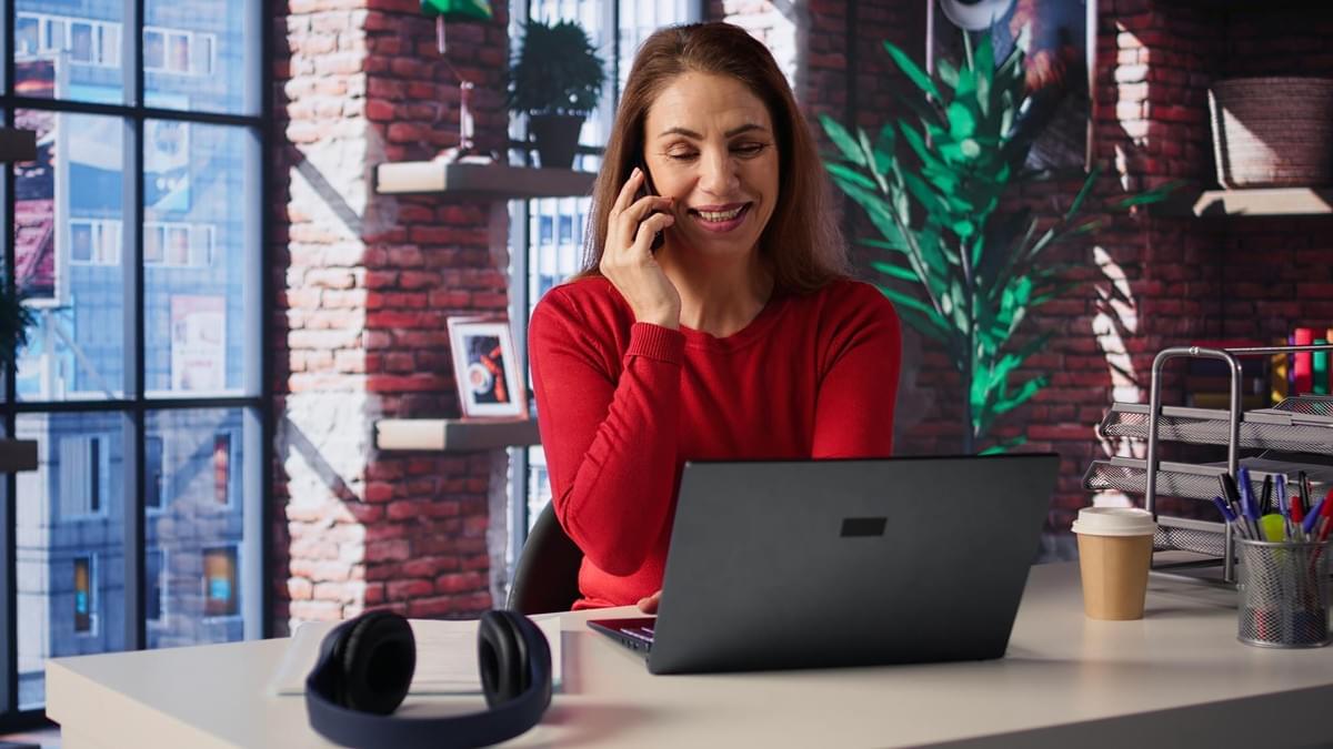 Digital marketing professional analyzing SEO performance charts on laptop to improve Google rankings and AI search visibility