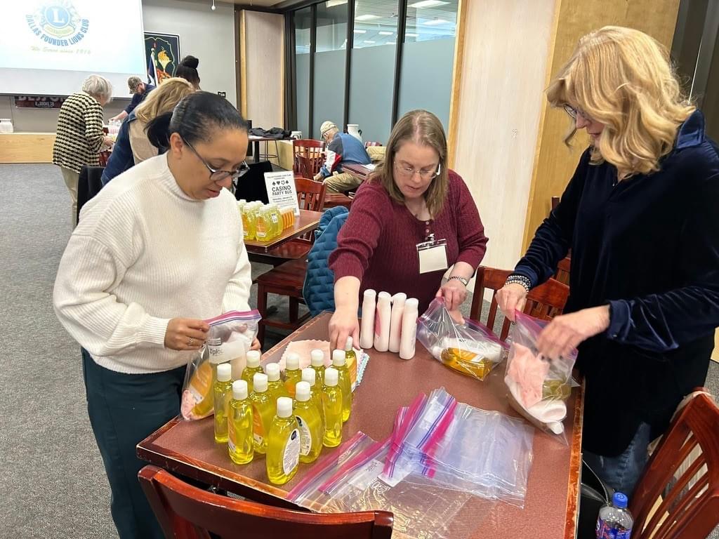Dallas Founder Lions members making baby hygiene kits for Hope Supply.