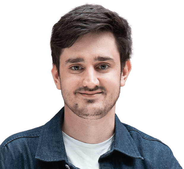 Portrait de Niklaus Schneider, membre de l'équipe, aux cheveux bruns, vêtu d'un t-shirt blanc et d'une chemise bleu foncé.