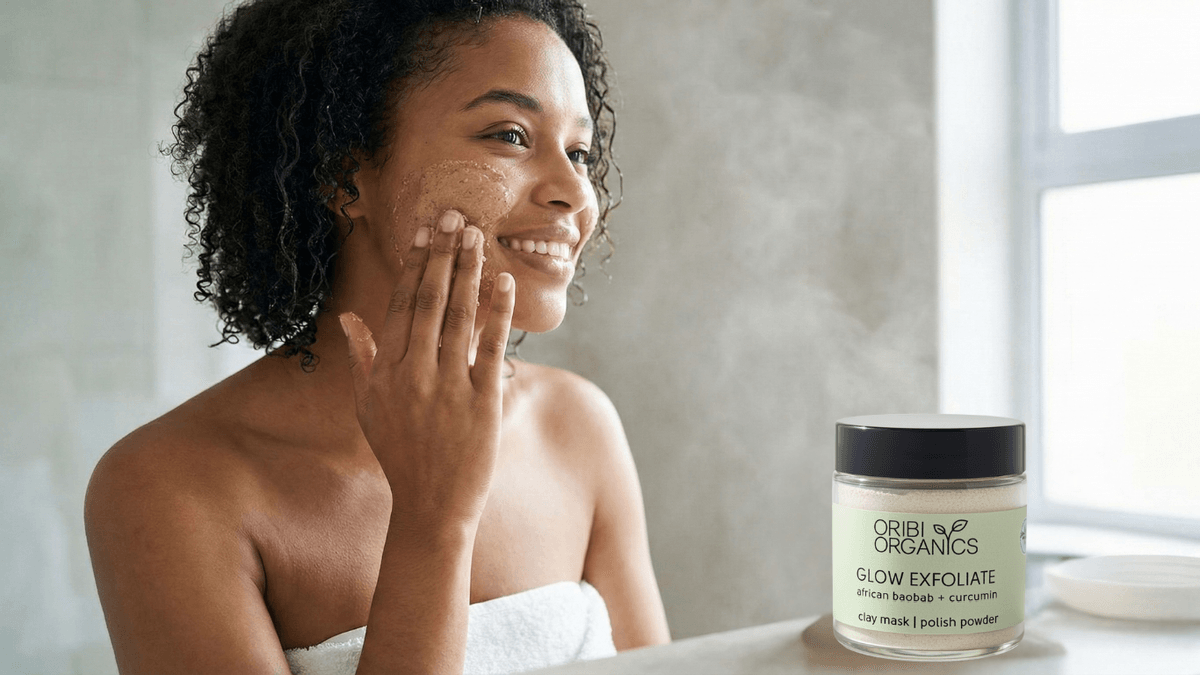 Young woman enjoying a self-care moment with the Oribi Organics Glow Exfoliate mask, available on Glowlink.