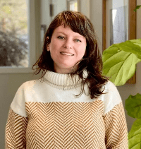 Erin, Licensed Acupuncturist, practicing Shiatsu massage with a calm and focused demeanor, offering holistic healing for pain relief and emotional well-being.