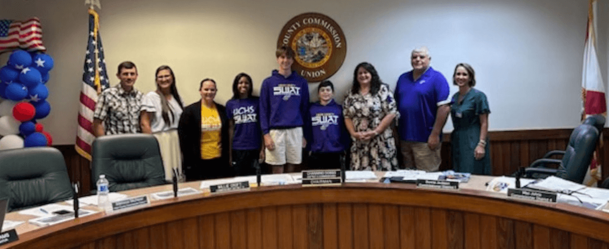 Union County SWAT youth posing with Union County Commissioners after the passing of the new tobacco-free parks ordinance.