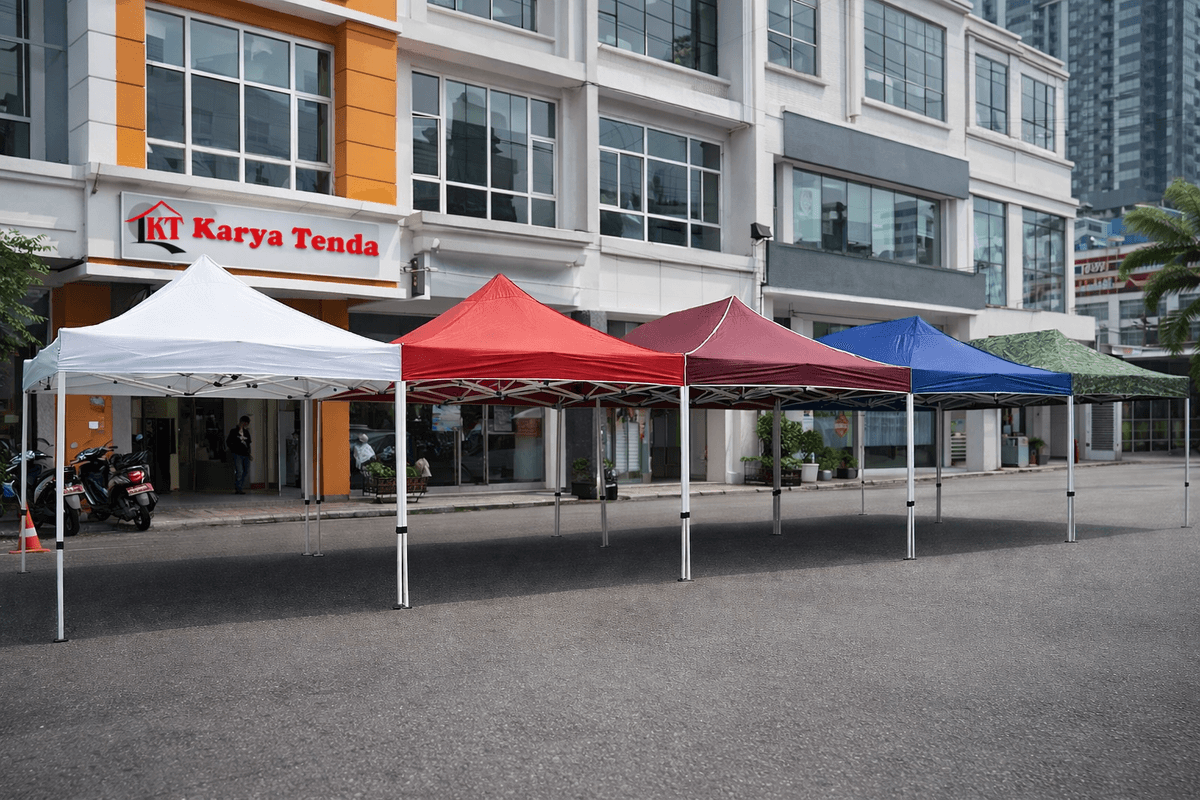 Jual tenda lipat 3x3 kualitas premium produksi Karya Tenda Jakarta siap kirim ke seluruh Indonesia  Spesifikasi rangka tenda lipat besi hollow anti karat dengan sistem pengunci otomatis yang kokoh  Bahan atap tenda lipat waterproof D600 dan PVC Tarpaulin tahan panas dan air untuk jualan outdoor  Proses produksi tenda lipat tangan pertama di workshop Karya Tenda Jakarta melayani grosir dan eceran  Jasa pembuatan tenda lipat custom logo branding perusahaan dengan cetak digital printing tajam  Pengiriman tenda lipat Karya Tenda ke luar kota melalui ekspedisi kargo aman ke Sumatera Kalimantan dan Papua  Berbagai pilihan ukuran tenda lipat praktis mulai dari 2x2 2x3 hingga 3x6 meter ready stock