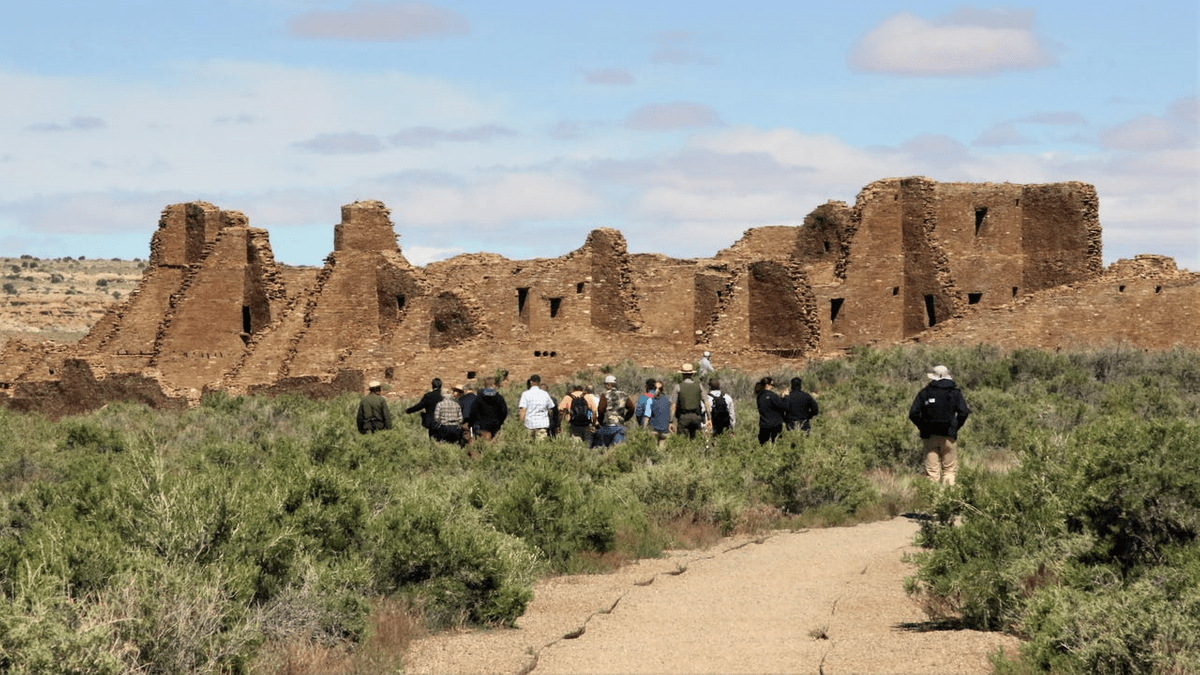 A group including Interior Secretary David Bernhardt and U.S. Sen. Martin Heinrich, D-NM, walk, Monday, May 28, 2019, toward Pueblo Bonito at Chaco Culture National Historical Park. PHOTO: HANNAH GROVER/THE DAILY TIMES