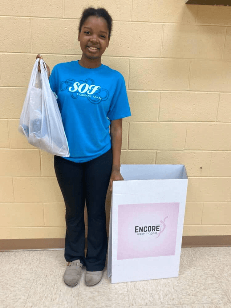 At Encore, we believe in the power of community and sharing. Our initiative not only provides gently used dancewear to those in need but also promotes sustainability by reducing waste. Every donation helps a dancer continue their passion without the financial burden of new gear. Community Impact What We Do What is Encore?Encore is a community service initiative started by June Ella Hyams when she was in the 6th grade.  Beautifully designed donation boxes are housed at dance studios throughout the Charleston, South Carolina area.  Lightly used or new dancewear, athletic wear, and shoes are donated to the boxes, and once the box is near full, we collect, clean, and ship the items to those in need.How did Encore begin?June Ella noticed that she was growing quickly out of her new dancewear and her mother noticed she had even outgrown some dancewear that still had tags on them before she got the chance to wear them.  This became the idea of sharing these clothes with other dancers.  Dancewear can be expensive, so this program helps to ease the financial burden for growing dancers as well as putting the dancewear back into good use for their own "encore".