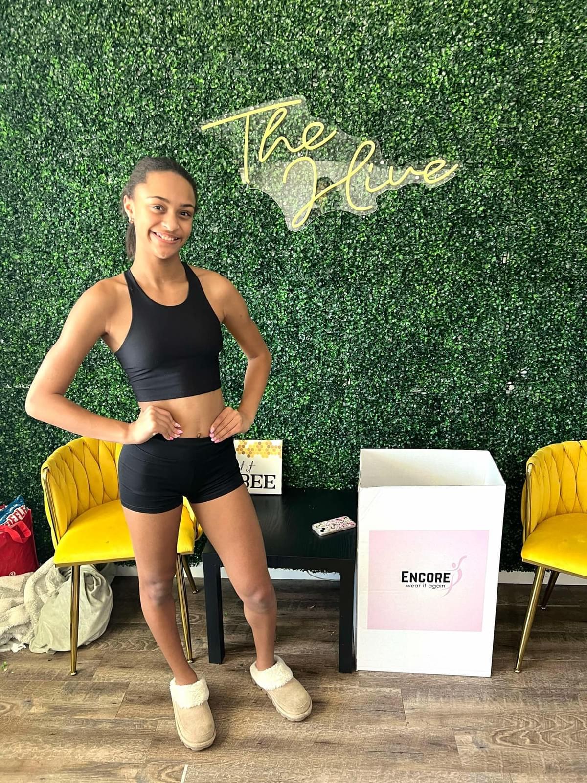 At Encore, we believe in the power of community and sharing. Our initiative not only provides gently used dancewear to those in need but also promotes sustainability by reducing waste. Every donation helps a dancer continue their passion without the financial burden of new gear. Community Impact What We Do What is Encore?
Encore is a community service initiative started by June Ella Hyams when she was in the 6th grade.  Beautifully designed donation boxes are housed at dance studios throughout the Charleston, South Carolina area.  Lightly used or new dancewear, athletic wear, and shoes are donated to the boxes, and once the box is near full, we collect, clean, and ship the items to those in need.

How did Encore begin?
June Ella noticed that she was growing quickly out of her new dancewear and her mother noticed she had even outgrown some dancewear that still had tags on them before she got the chance to wear them.  This became the idea of sharing these clothes with other dancers.  Dancewear can be expensive, so this program helps to ease the financial burden for growing dancers as well as putting the dancewear back into good use for their own "encore".