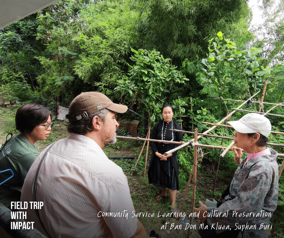 Educational travel participants experiencing living heritage and cultural traditions in a Tai Dam village