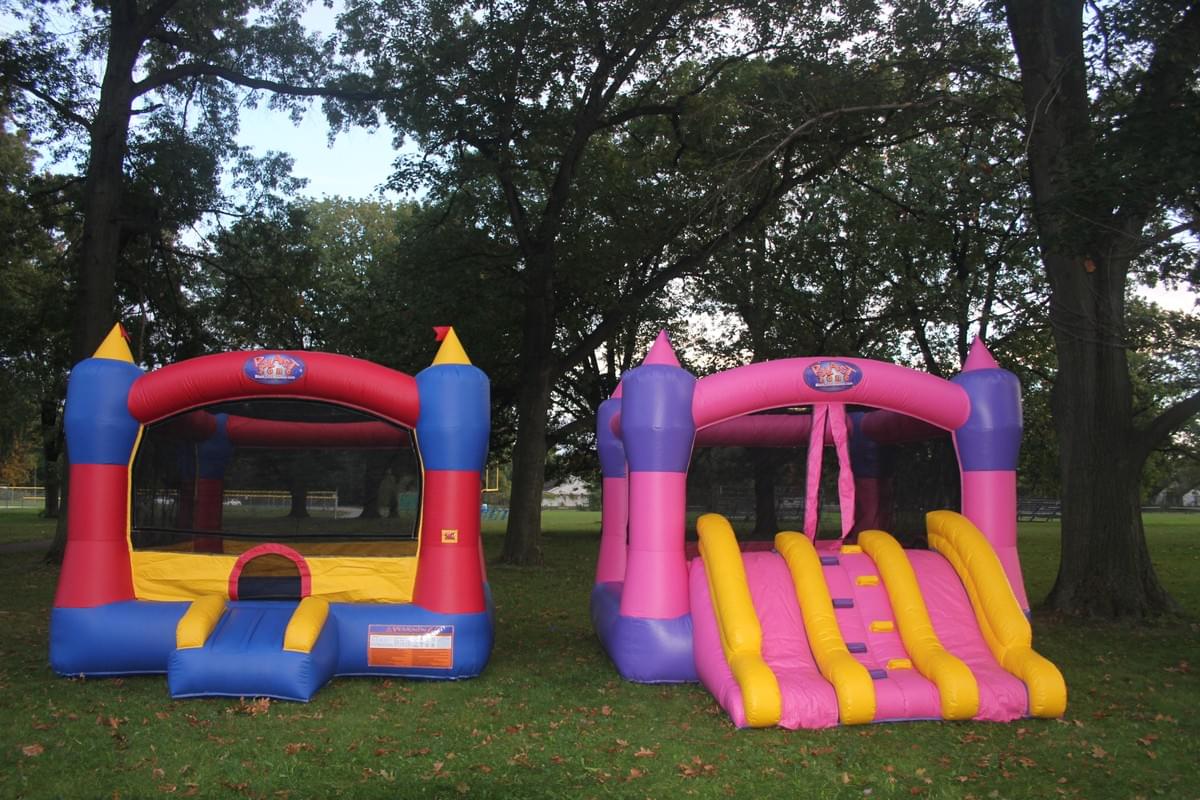 Bounce house and inflatable water slide rentals set up for backyard in Beverly Hills Michigan