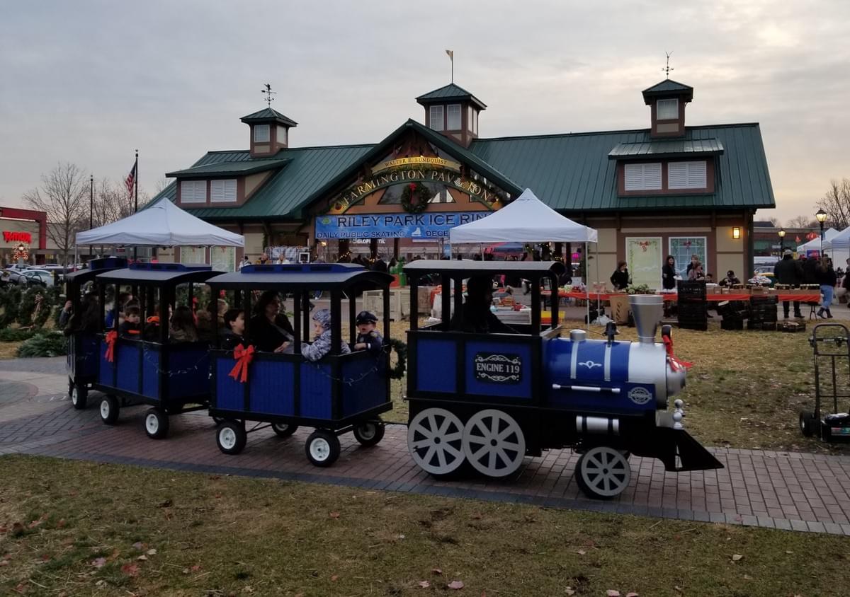 Party equipment rental in Troy, Michigan featuring a trackless train for community events