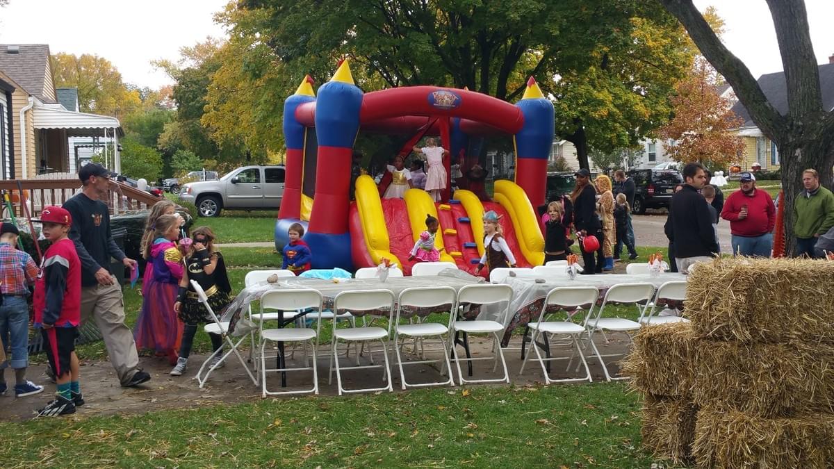 Bounce house rental set up for a community event in Warren, Michigan with tables and seating Bounce house rental set up for a community event in Warren, Michigan with tables and seating