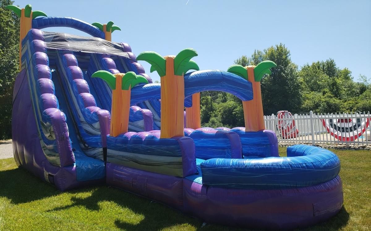 Bounce house and inflatable water slide rentals set up for backyard in Southfield, Michigan