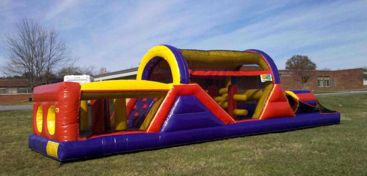 Bounce house and inflatable water slide rentals set up for backyard in Rochester, Michigan