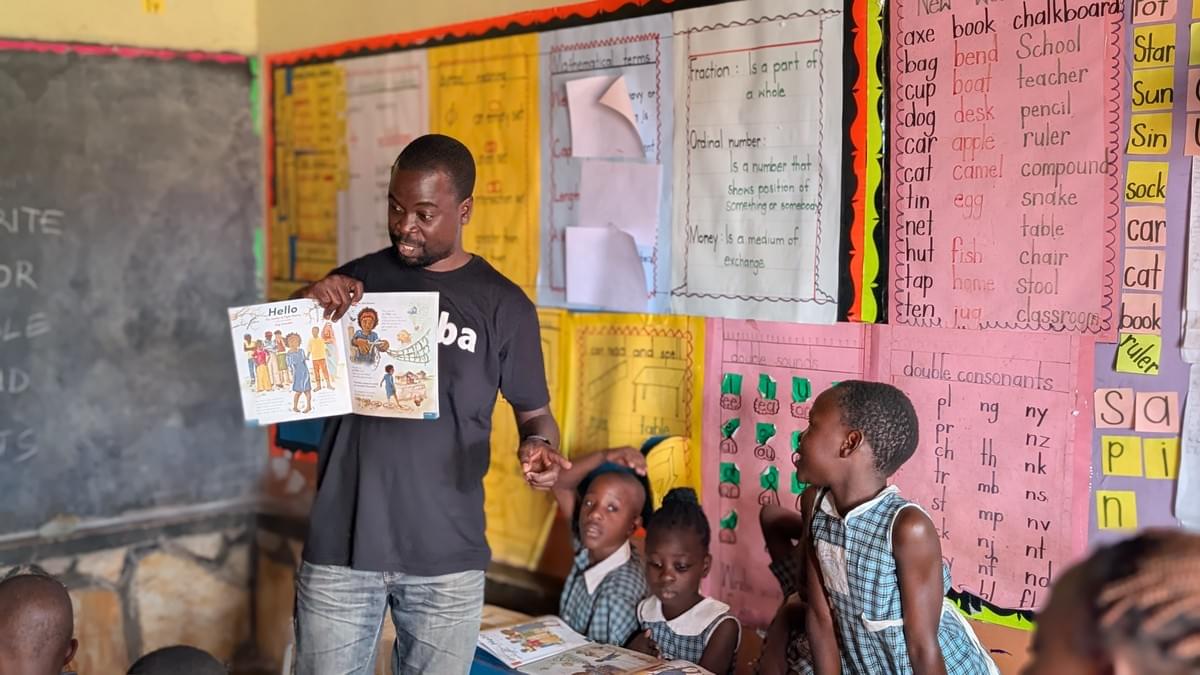 Our Chief Literacy Officer, William Mukisa during a community reading outreach at St Anne Preparatory in Lunnya, Kigo..