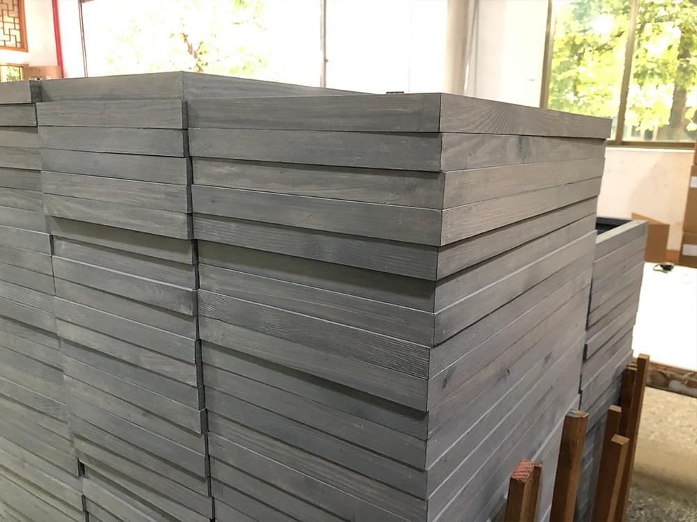 Gray hand-distressed wood sign blanks prepared for wholesale orders