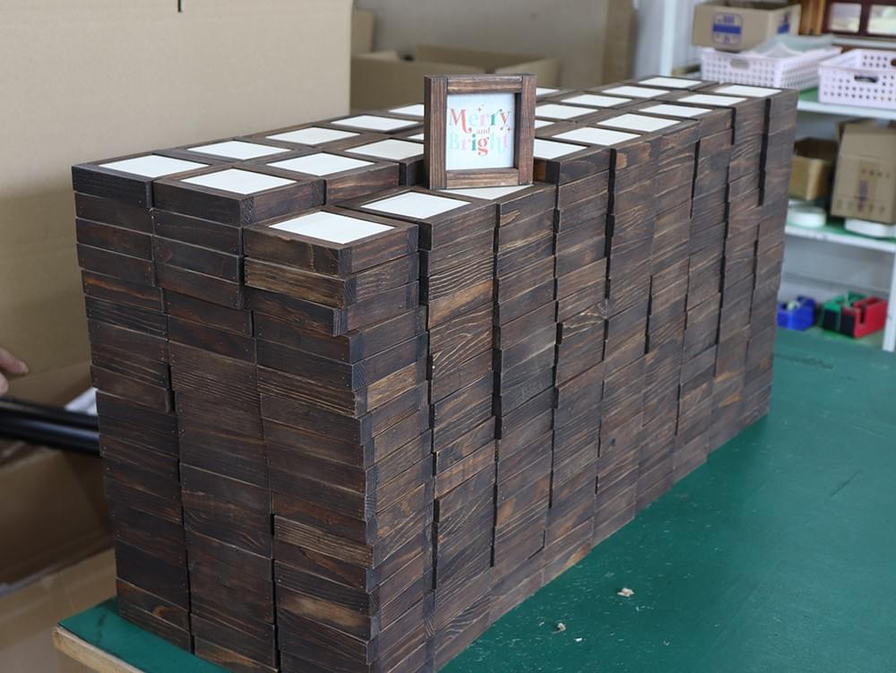 1. Finished dark wood picture frames prepared for inspection and export packing 1. Finished dark wood picture frames prepared for inspection and export packing