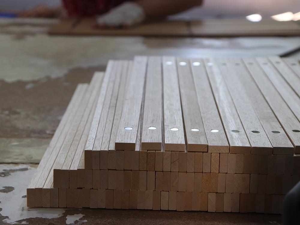 Wooden poster hanger strips with magnets prepared for bulk production