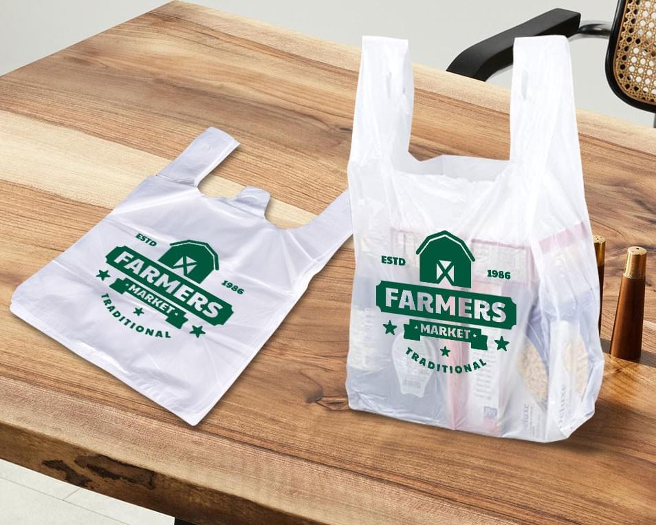 Custom T-shirt plastic bag manufacturer in Malaysia offering durable shopping bags with printed logo for retail and grocery use.