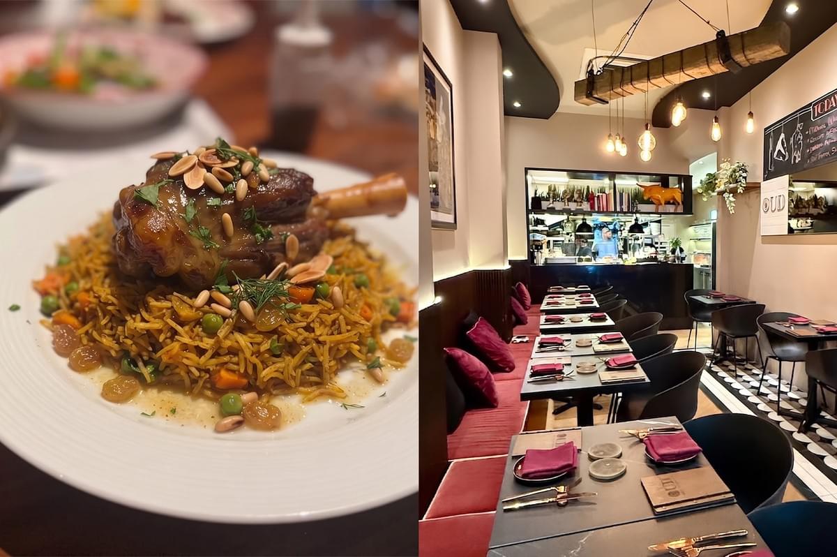 Traditional halal lamb dish served over spiced rice with nuts at OUD Restaurant with a view of its modern interior.
