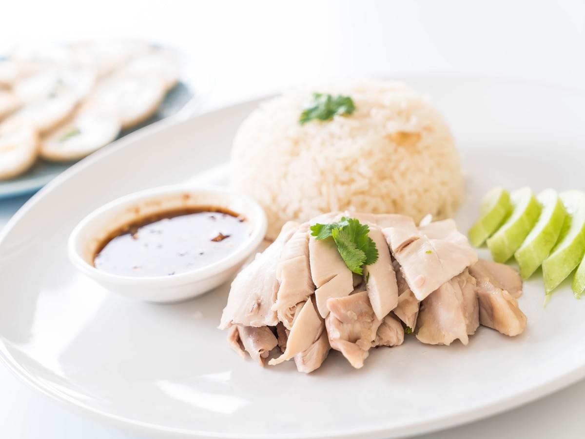 A dutch angle shot of a chicken rice aesthetically presented.