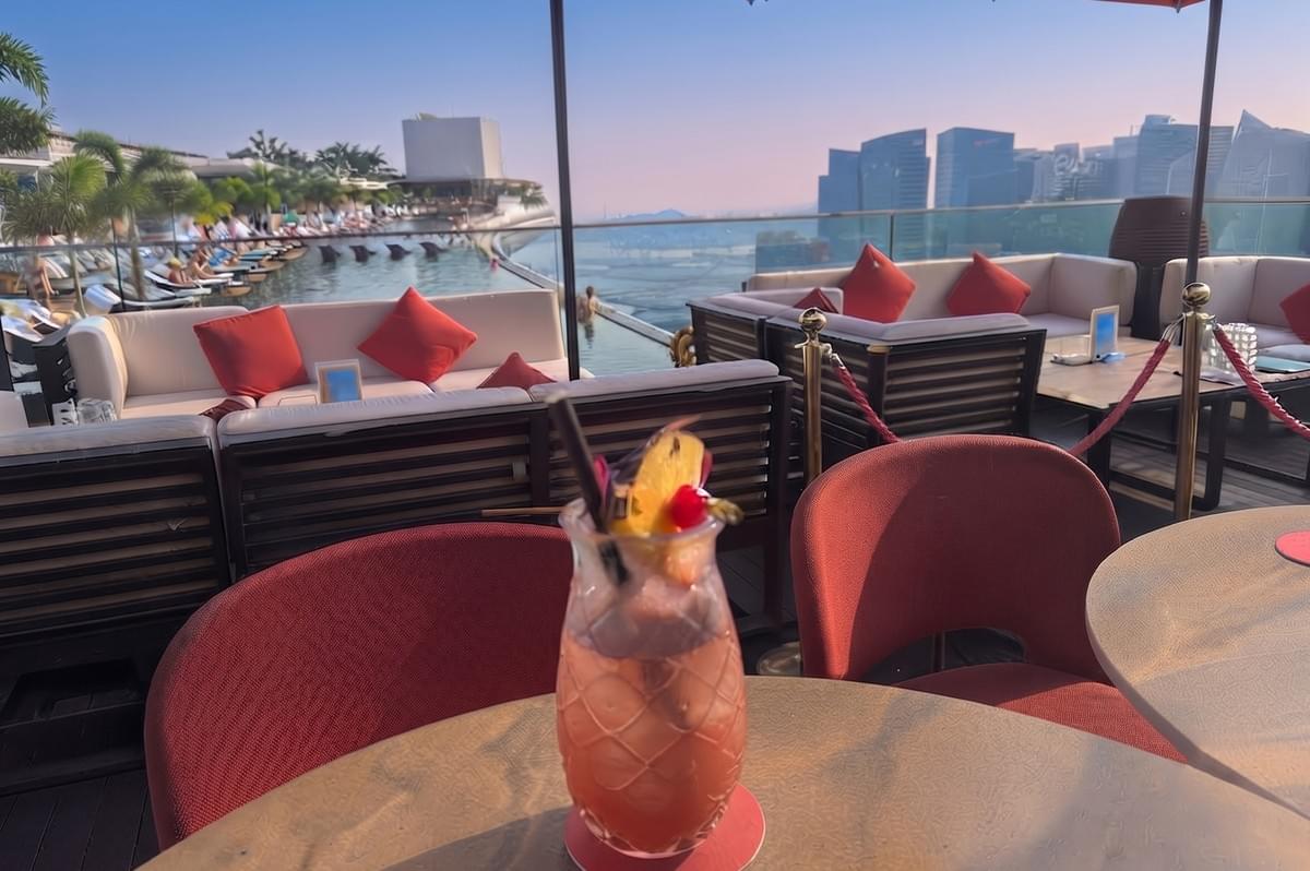 Cé La Vi Singapore rooftop cocktail lounge overlooking the skyline and Marina Bay Sands pool.