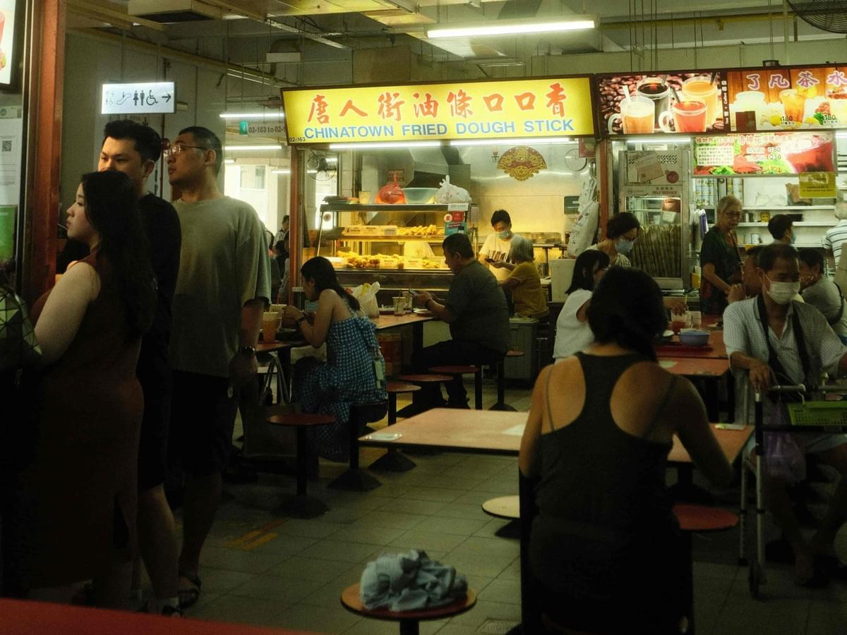 An aesthetically pleasing shot of the hawker eatery during busy hours.