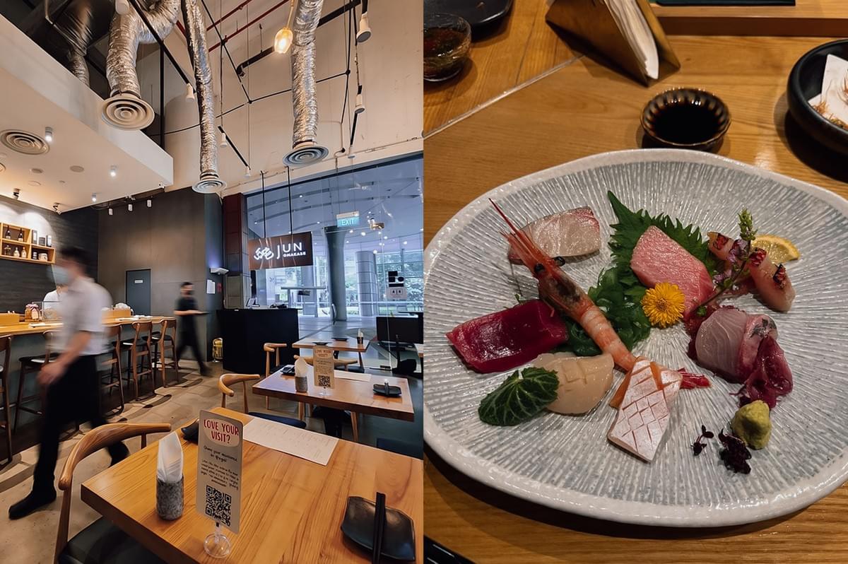 Left: Interior of Jun Omakase restaurant, showing wooden dining tables, a sushi counter bar on the left, high ceilings with exposed metallic ventilation pipes, and a view through glass windows toward a brightly lit building lobby. Right: Top-down view of an artfully arranged sashimi platter on a light grey ceramic plate, featuring fresh cuts of raw fish—including tuna, salmon, and white fish—alongside a whole sweet shrimp, garnished with edible flowers and leaf greens.