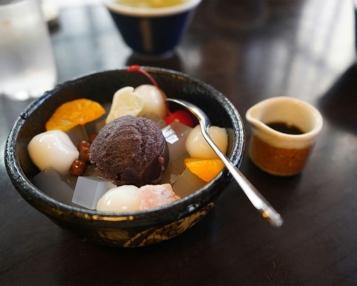 A plated dessert placed neatly on a table, with soft lighting highlighting its texture and presentation, suggesting a sweet moment of indulgence.