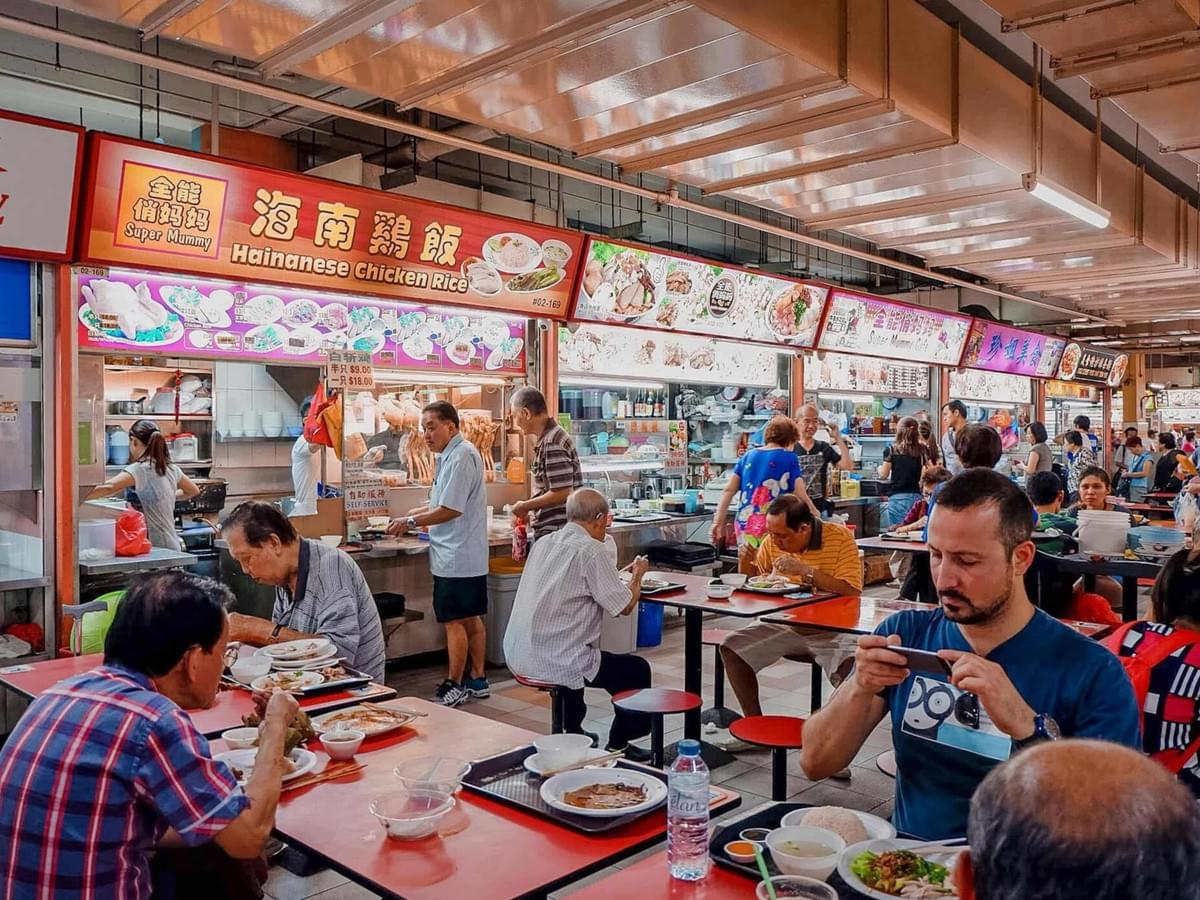 A proper display of Hawker Centre Etiquette where diners eat in a clean and organized manner.