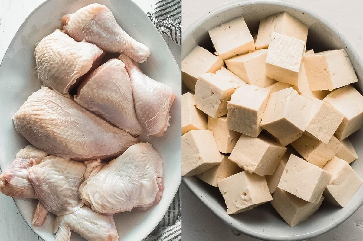Raw chicken pieces and cubed tofu displayed side-by-side in white bowls for cooking Thai green curry.