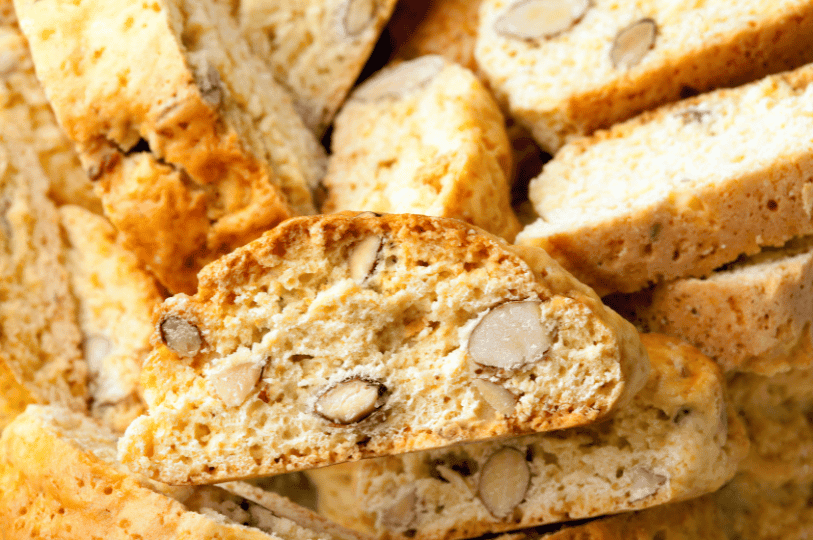 Golden-brown biscotti studded with almonds, their crisp texture and rustic edges hinting at twice-baked perfection—ideal for dipping into coffee or wine.