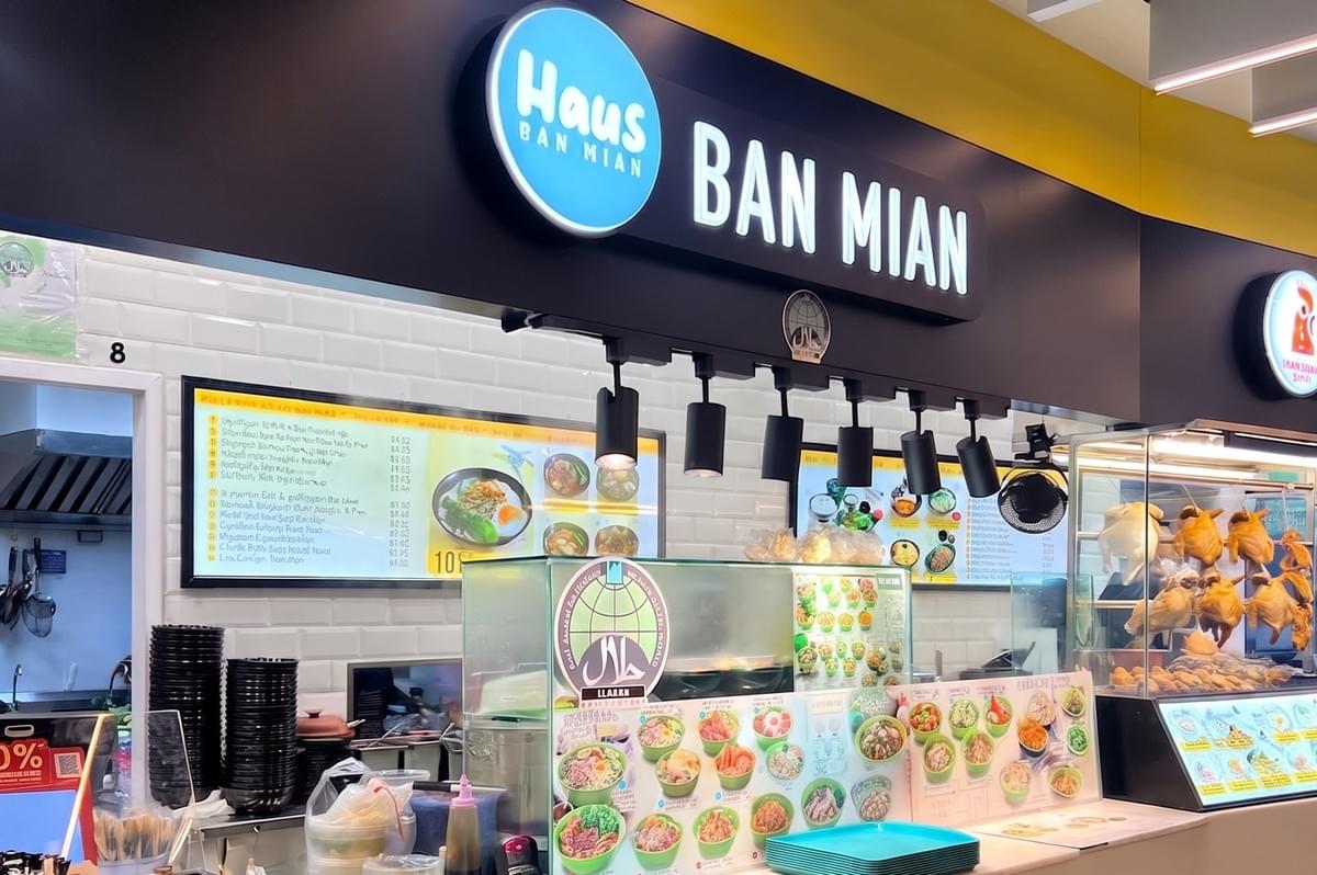 Haus Ban Mian restaurant storefront with a menu board and display counter.