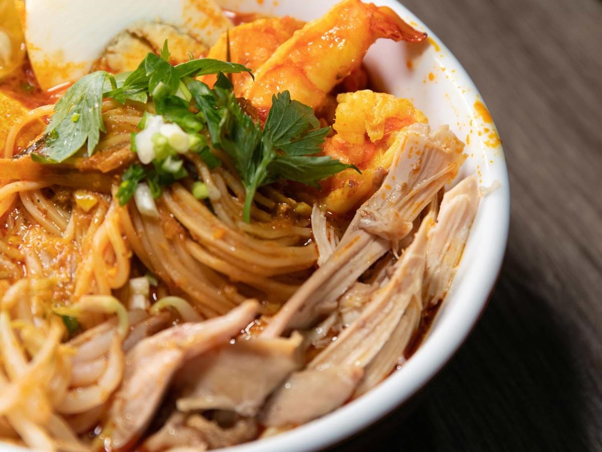 A delicious bowl of Prawn Mee, beautifully capturing its ingredients. 