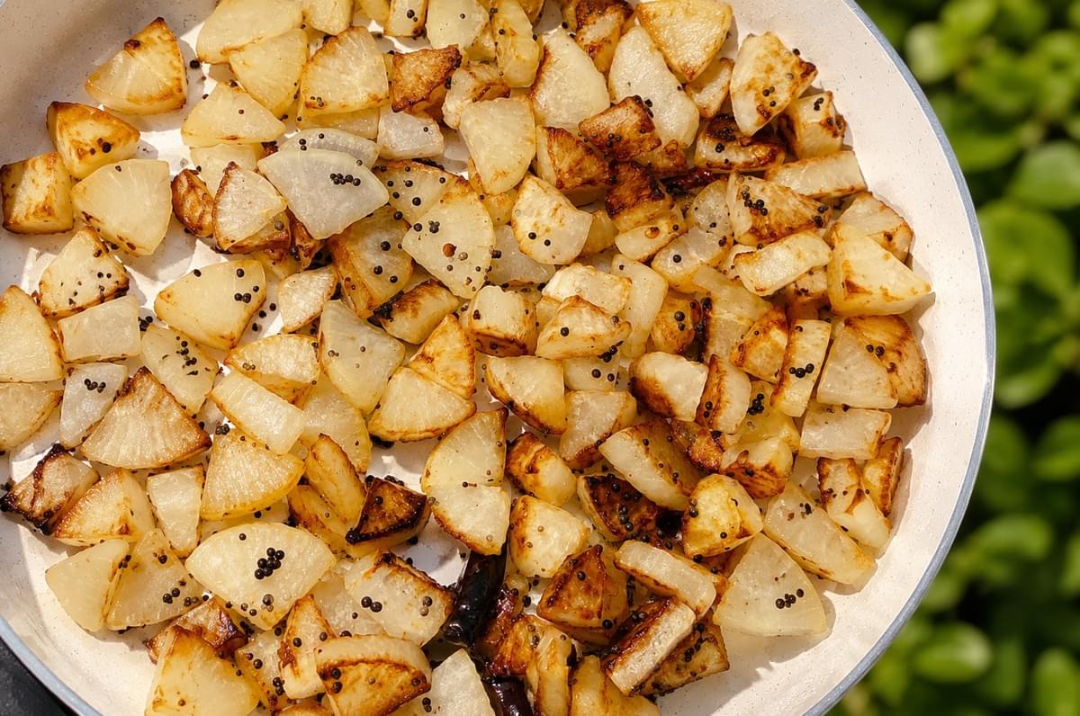 Pan-fried, golden radish cubes seasoned with black mustard seeds.