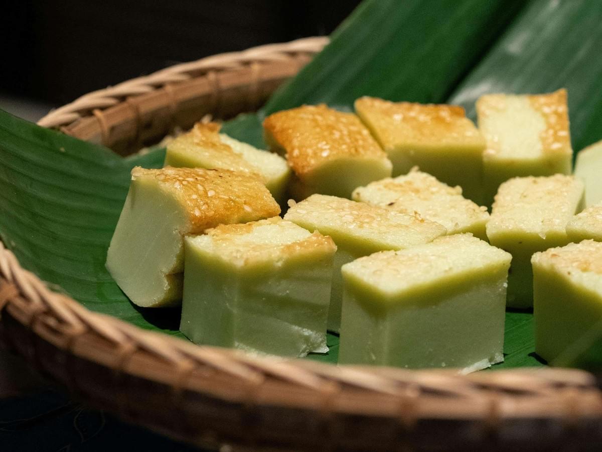 Nyonya Kueh, beautifully laid out on a banana leaf plate.