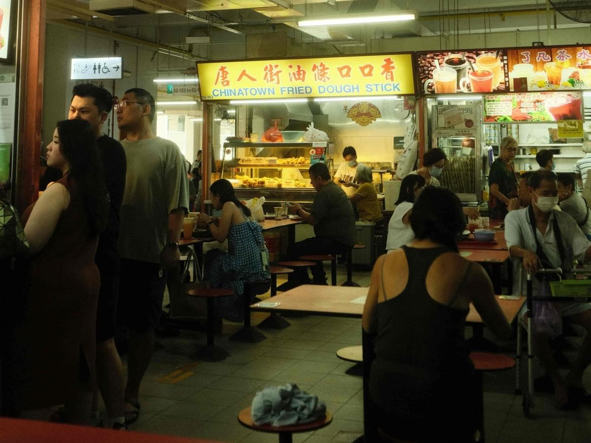 An aesthetically pleasing shot of the hawker eatery during busy hours.