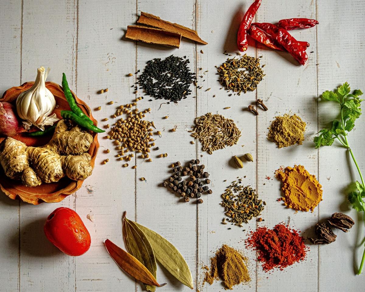 An assortment of colourful whole spices displayed together, showcasing the key ingredients used to build the deep, layered flavour of Hokkaido soup curry.