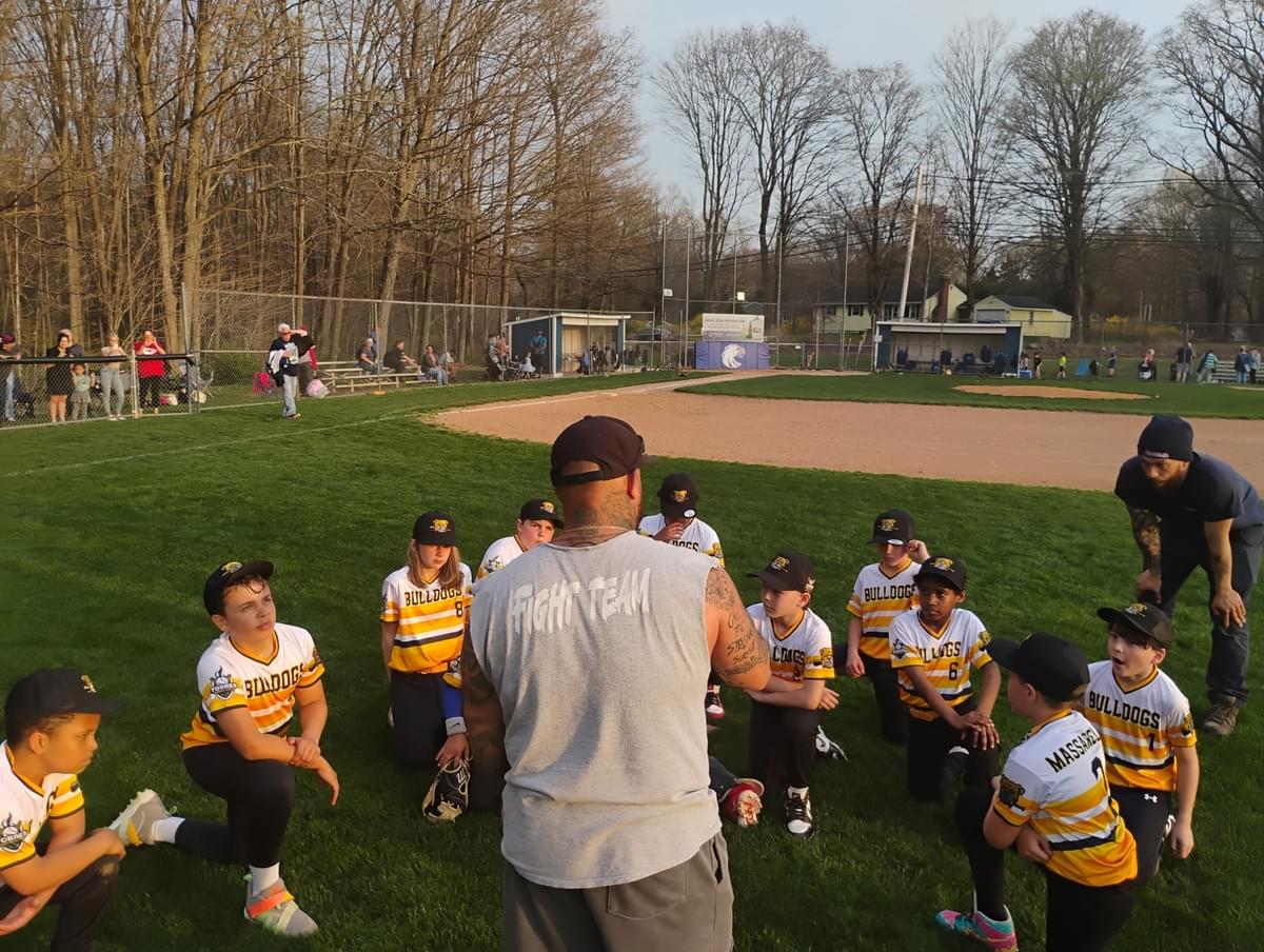 Coach JT leading the Park City Bulldogs baseball team.