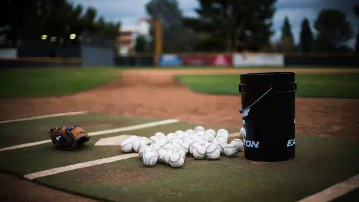 A bucket of baseballs ready for practice.
