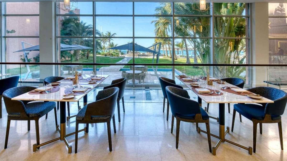 alt="Custom hotel restaurant furniture, dining chair and table set by Moontree"